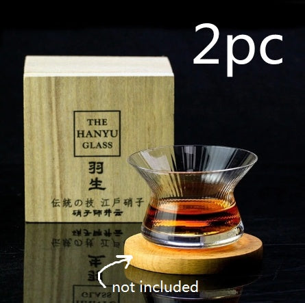 Whiskey glass with rotating spirits