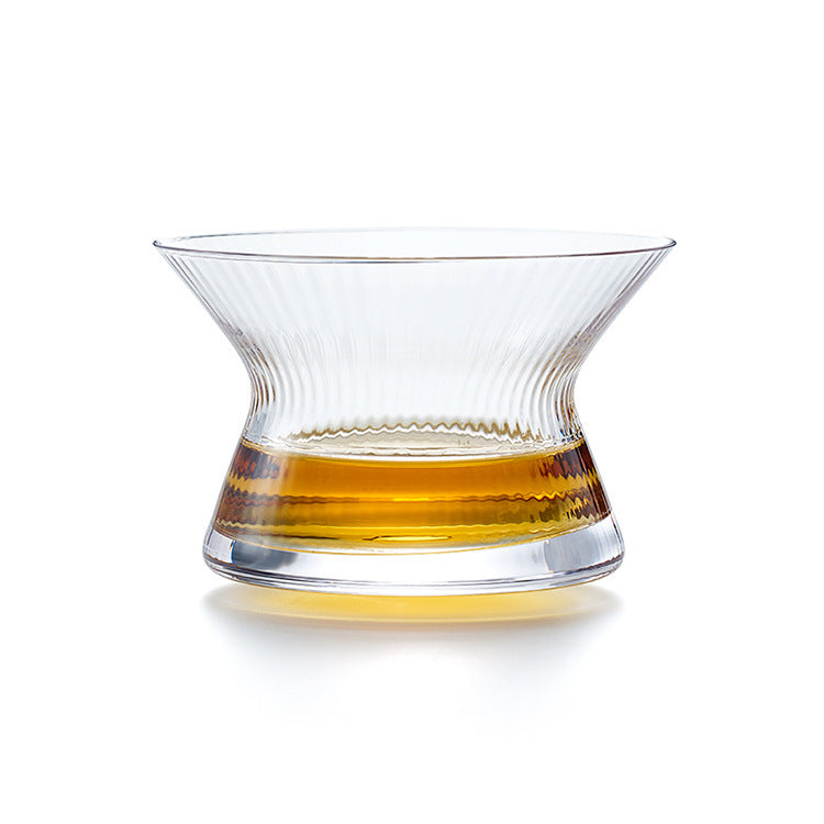 Whiskey glass with rotating spirits