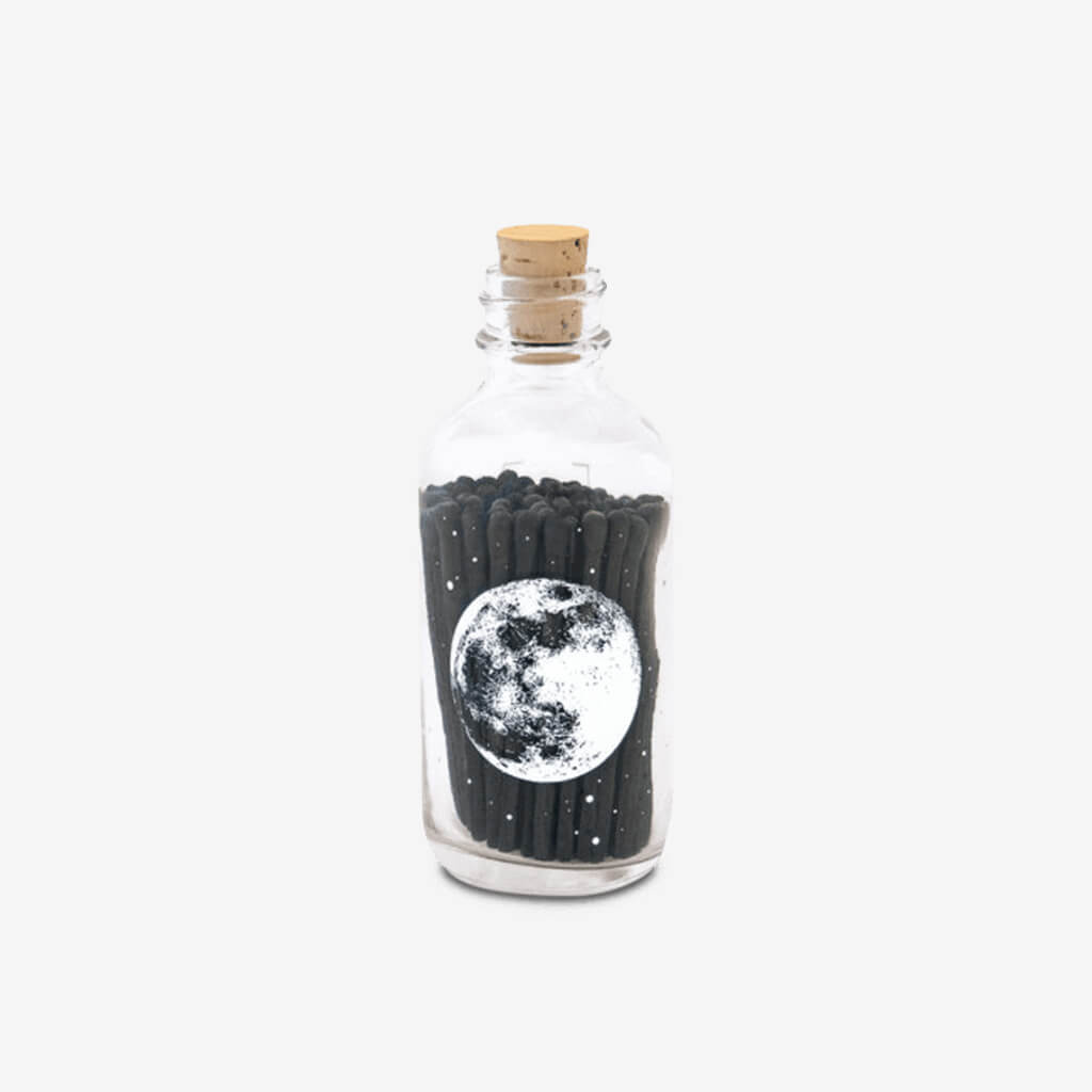 Skeem&#39;s apothecary match bottles are a sophisticated and updated option for storing your matches, featuring a silk-screened design and cork lid.  The adorable mini Astronomy bottle shows the full moon with all its craters. The bottles feature their exclusive strike-on-bottle design and have a striker strip on the back of the bottle for lighting all your matches in style.  40 - 2&quot; Matchsticks Strike-on-bottle flint 4&quot; high x 1 1/2&quot; wide
