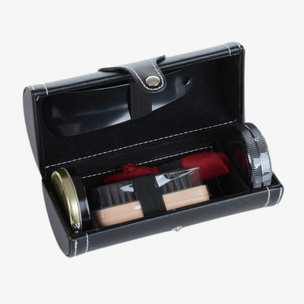 A handsome designed kit for the man that truly appreciates an incredible pair of shoes. Bring this travel-size kit with you on-the-go or shine your shoes at home.  Includes: Shoe shine. Shoe horn. Brush. Cloth. Carrying case