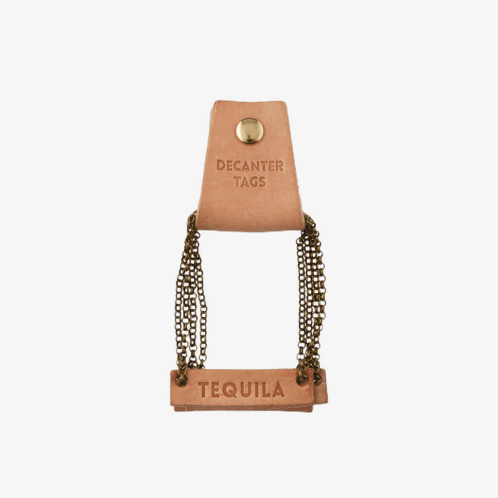 Style your bar cart and dress up a decanter with a leather decanter. Genuine leather with metal chain.     Set of 4 Tags: Vodka, Tequila, Gin, Whiskey  Say &quot;cheers&quot; with the perfect hostess gift.