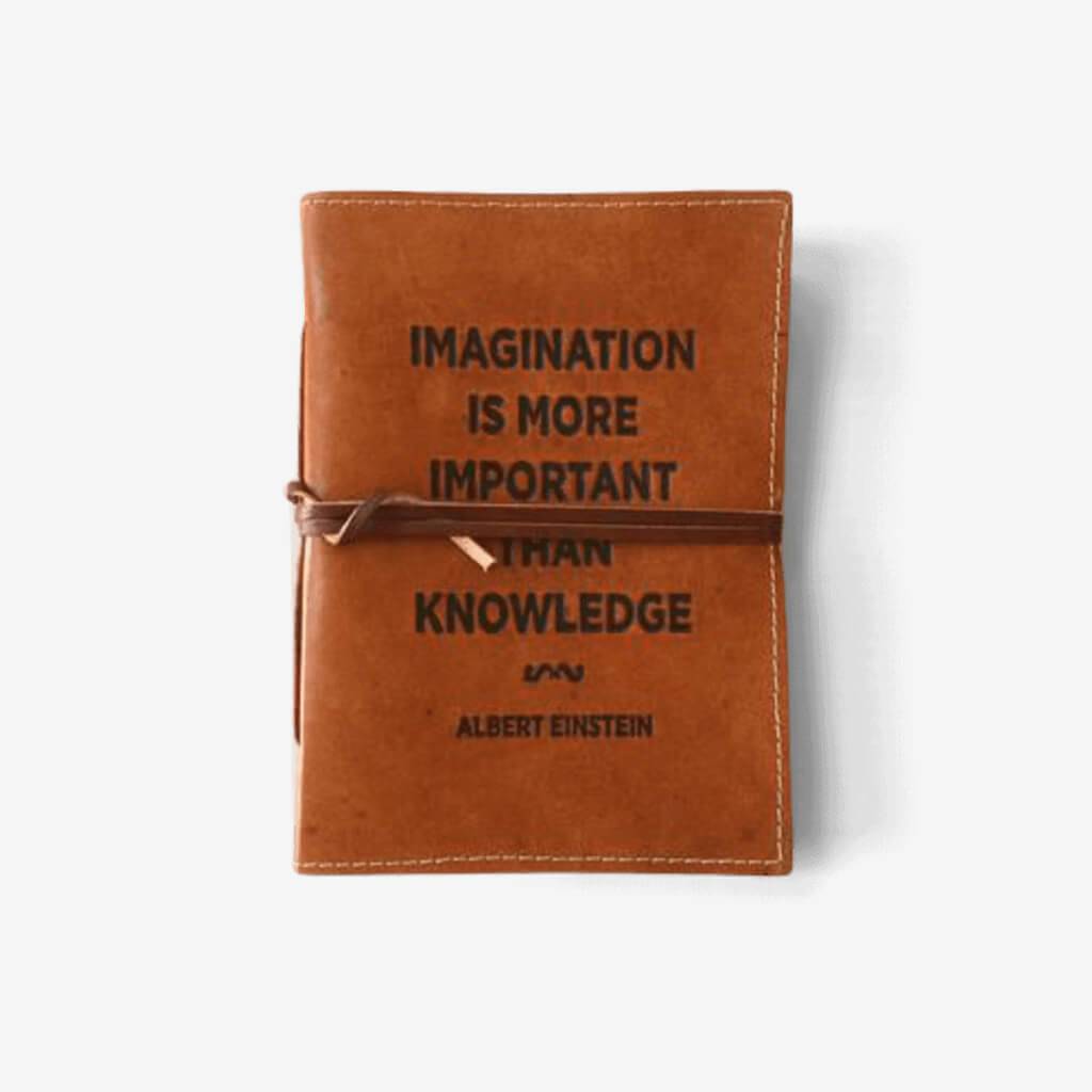 Genuine Leather Notebook with Embossed Saying &quot;Imagination is More Important Than Knowledge&quot; Leather books will never go out of style. These genuine leather bound books are full of handmade paper that is hand stitched together. With a wonderful embossed saying this notebooks is the perfect gift to those who journal.