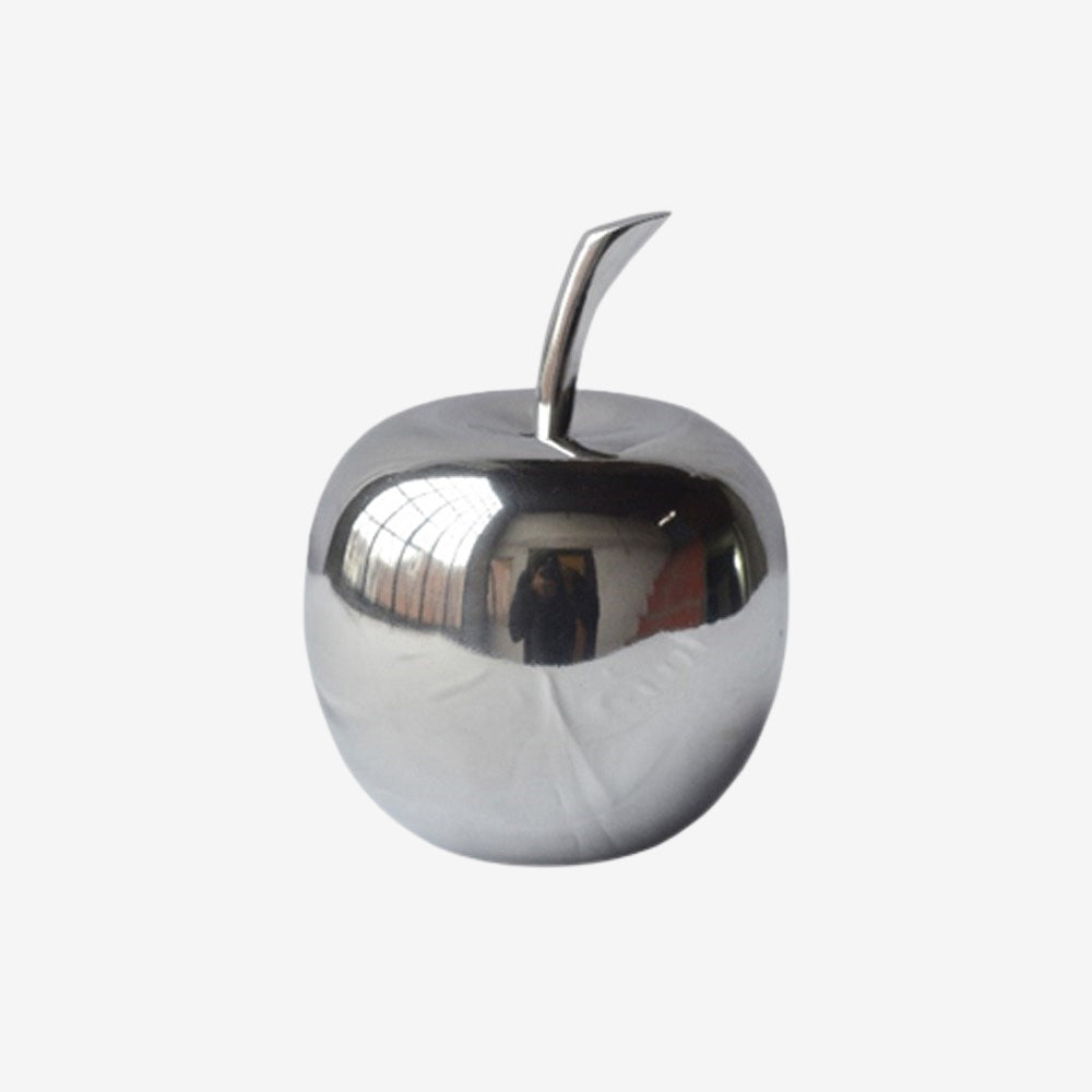 The perfect accent decor for any contemporary living space, the Manzano Polished Apple is both classic and trendy. Made of cast aluminum then buffed to a shiny silver luster, this modern and bright piece can be arranged on a bookshelf, corralled on an accent tray, or displayed in the kitchen.