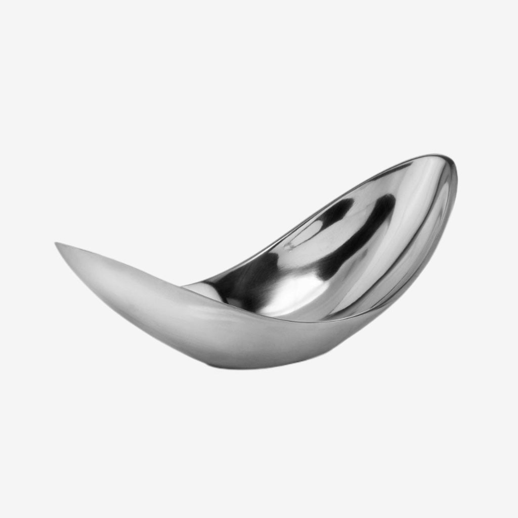 The perfect accent for your kitchen counter or display case, the Sesgo Twisted Bowl makes a sophisticated statement in your home. Featuring minimalistic design, this bowl is made of aluminum and boasts a buffed shiny silver luster. With upturned corners, this bowl showcases an oval shape and is great for holding smaller fillers, potpourri or wrapped candies.