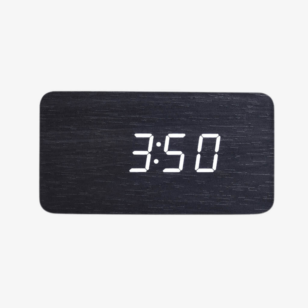 Digital desktop alarm clock for home or office with vibrant LED display! Fashionable and portable, too. Sleek rectangle shape made of wooden material. Bright LED time display and alarm capabilities. Battery operated allows for portable placement at home or office.
