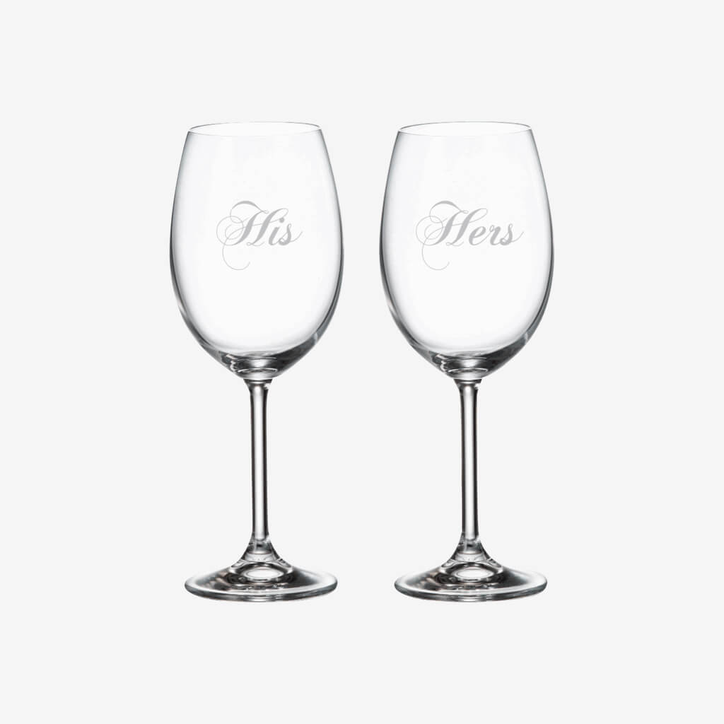 Raise a toast with these specially designed glasses!  Lead-free crystal glasses, made in Europe with frost colored print. Ideal for wedding registries, anniversary and wedding gifts. Gift set includes 2 Red Wine glasses in gift box.  Print “His &amp; Hers”